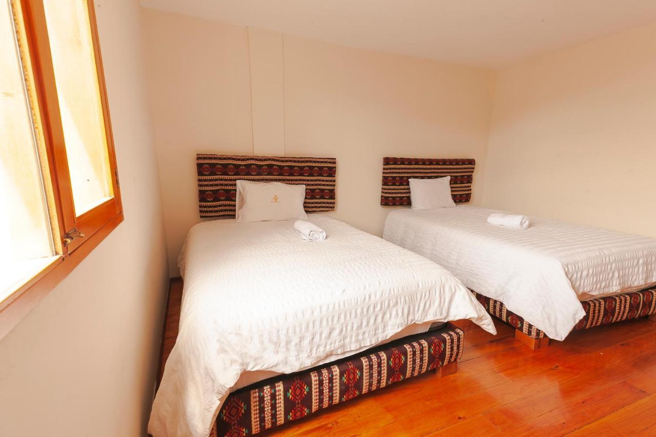 Los Ponchos Inn Apartasuite โอตาวาโล ภายนอก รูปภาพ
